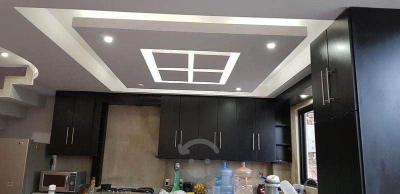 Espresso kitchen cabinets installation in progress Las Vegas