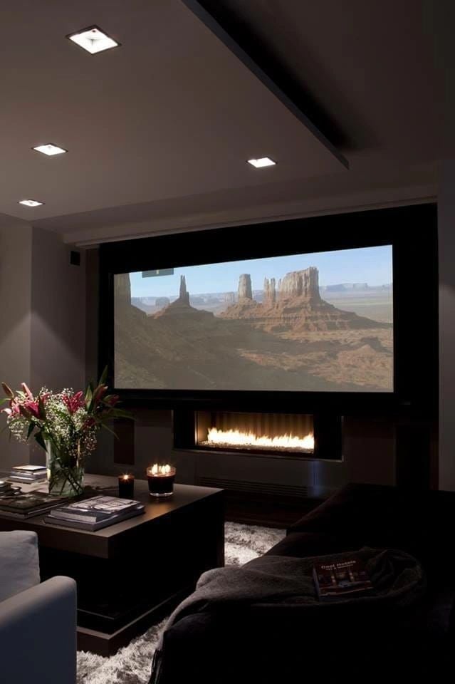 Custom home theater with fireplace feature wall Las Vegas